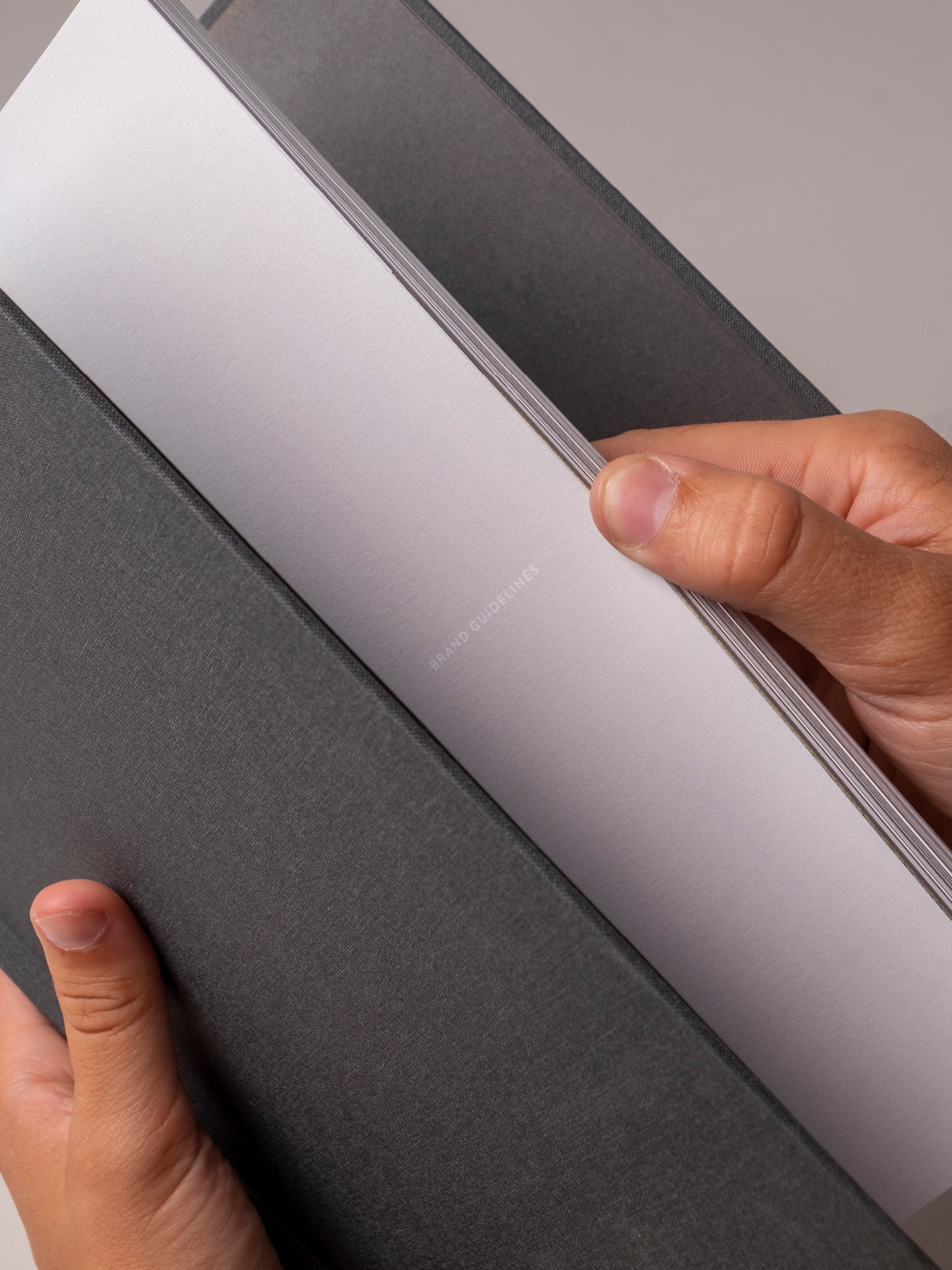 Detailed shot of the opening the brand guidelines book
