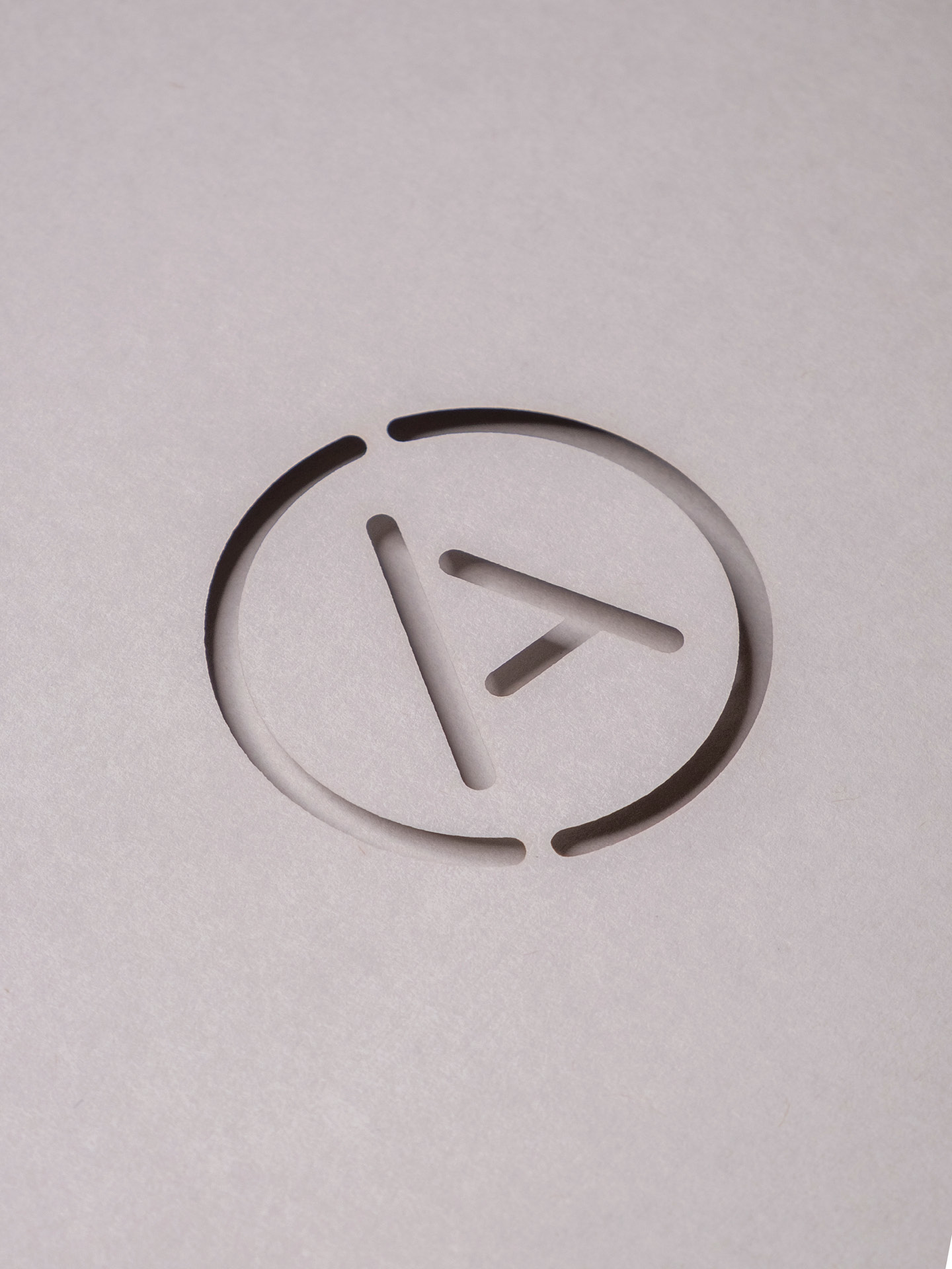 A detailed photo of the Agilita marque die cut with shadow