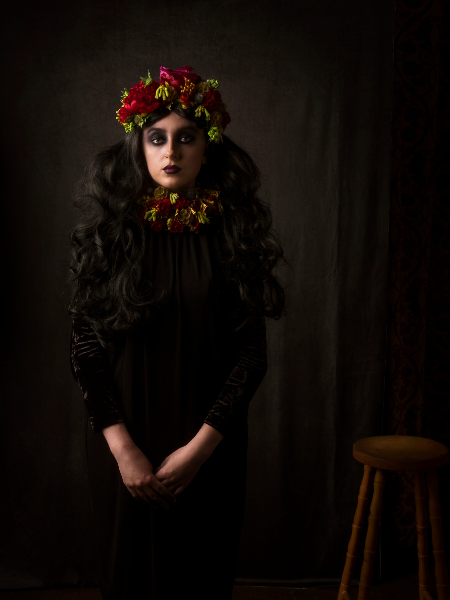 Portrait photography of model Bethan Perkins combining both vintage styling and modern methods with visible stool and hair with volume